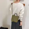 Bolso tipo cubo estilo nuevo temperamento exquisito nicho 2026 bolso cruzado versión coreana moda casual para mujer diseño de un solo hombro