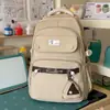 Mochila de estilo universitario color rosa melocotón, juguetona, para chicas estudiantes, suave, dulce y enérgica, bolso escolar versátil para clases y salidas