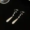 Brincos de Franja Gota de Água Pérola Francesa Clipe de Orelha Espiral de Mosquito Feminino 2025 Novos Brincos de Alto Padrão Estilo Chinês Brincos