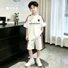 Traje Deportivo para Niños y Niñas de Manga Corta y Pantalones Cortos Nuevo Estilo 2026 Conjunto de Dos Piezas Moderno y Elegante para Niños de Edad Media y Mayores