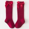 Meias para Bebê Novas Primavera e Outono 2025 Meia Meia-Calça Listrada com Laço Boca Larga Meias para Bebê de 1 Ano Estilo Europeu e Americano Meias Infantis