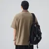 Camisa polo casual de estilo americano con media cremallera para hombre, ajuste holgado de verano con hombros caídos, tacto de alta gama, camiseta tipo pullover holgada de manga corta