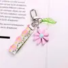 Chaveiro Minimalista Estilo Ins Hyuna Colorido Doce de Renda com Pingente Simples de Flor Margarida Acessório para Fone de Ouvido Bluetooth