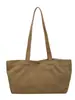 Bolsas de lona casuales de nicho al por mayor para mujer, nuevo bolso tote simple de color liso de gran capacidad, bolso de hombro para el antebrazo para el trabajo