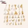 2026 Nuevo Modelo Cobre Chapado en Zirconio Oro Real 18K Cuentas Espaciadoras Cola de Pez Mariposa Campana Accesorios para Pulsera Collar DIY