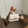 Bolso simple de tendencia de nicho estilo coreano 2026 invierno nuevo de nicho cereza dulce moda casual bandolera para mujer