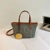 Bolsa de Palha Tecida Leve Nova 2026 Bolsa de Mão Casual para o Dia a Dia Bolsa de Ombro Estilo Balde Bolsa de Cesta Tecida de Comércio Exterior