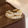 Anillo de cobre con incrustaciones de circonita de múltiples vueltas, nuevo modelo de lujo ligero transfronterizo para mujer, anillo abierto ajustable personalizado de alta gama al por mayor