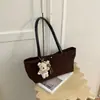 Bolsa tote minimalista de nicho estilo coreano transfronteiriça, novo modelo 2026, bolsa de ombro de grande capacidade, bolsa de ombro retrô de nicho para o dia a dia