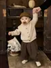 Roupa de Bebê Estilo Coreano Cardigã de Tricô 2026 Primavera e Outono Novo Suéter Cinza de Alta Qualidade Roupa Externa Infantil