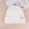 Gorro de lana con lazo dulce de Corea del Sur para mujer, gorro de lana para otoño e invierno, grande, combinable, cálido, con protección para las orejas, gorro de punto pequeño.