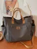 Bolso de lona vintage Shuai Mi Jia para mujer, bolso de hombro para mujer con múltiples bolsillos, adecuado para el trabajo y los desplazamientos, bolsa de almuerzo portátil, bolso cruzado casual