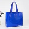 Bolsa de tela no tejida con láser para compras, bolsa de regalo publicitaria, bolso de mano tridimensional termosellado ultrasónico en stock, logotipo impreso