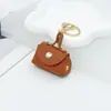 Encanto de mini bolso de cuero de moda estilo coreano, llavero, diseño creativo, disponible en varios colores, accesorio de mini monedero