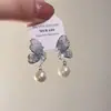 Aretes de Lazo de Circonita Micropavimentada Popular Coreana 2025 para Mujer Aguja de Plata S925 Nicho de Alta Gama Aretes de Perlas