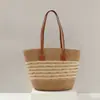 Bolso nuevo de paja tejida 2026 para vacaciones en la playa junto al mar, gran capacidad, versátil para el trabajo diario, bolso de hombro tipo tote tejido