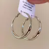 Pendientes statement de nicho de alta gama, nuevo modelo 2026, adelgazantes, elegantes pendientes de aro para mujer, diseño coreano, broqueles de plata