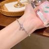 Pulsera de Perlas Coreana Popular de Nicho de Alta Gama para Mujer, Versátil y Exquisita Joyería de Mano con Lazo de Corazón de Zircón