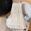 Foto real de uma saia midi de malha reversível para mulheres, outono e inverno, com acabamento em renda, versátil, modeladora, saia plissada estilo fada