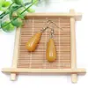 Venta al por mayor de fábrica aretes largos de cristal natural forma de gota de agua amatista Ojo de Tigre Joyería con gancho para la oreja aretes redondos de gota de agua DIY