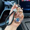 Chaveiro Olho de Demônio de Liga Oca com Strass Corda de Couro Trançada Pingente Olho Turco Azul Charme para Bolsa Atacado