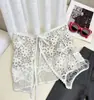 Falda de una pieza estilo retro con cordones bordados, falda de mezclilla en capas y media falda de delantal