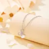 Colar com laço de luxo leve estilo francês para mulheres, nicho transfronteiriço europeu e americano, simples e elegante com pingente de pérola artificial