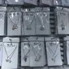 Loja de 2 yuans Conjunto de colar com corrente para clavícula, anel e brincos femininos, terno de combinação, pequeno presente, joias para estudantes