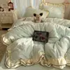 Juego de ropa de cama de cuatro piezas de terciopelo bordado con encaje de doble capa Xianmei, funda de edredón de terciopelo de leche de doble cara estilo coreano, sábana y sábana bajera de forro polar de coral