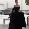 Vestido negro de estilo Hepburn francés al por mayor con hombros descubiertos, lazo y falda grande, temperamento de hermana real de verano para mujer, falda larga