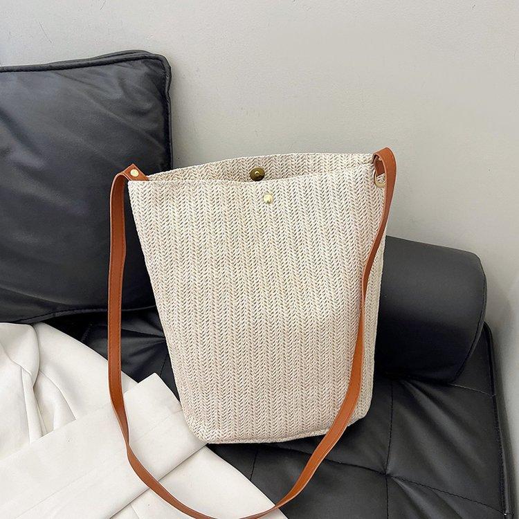 编织包女包新款潮2024夏草编简约百搭小清新水桶包个性单肩斜