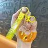 Llavero creativo de concha pequeña con aceite, lindo colgante pequeño de arena movediza líquida, accesorios para bolso, pequeño colgante de regalo, venta al por mayor