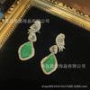 Pendientes de cobre antiguo occidental de circonio denso con incrustaciones de hojas verdes con borlas, luz de nicho exquisita y lujosa.