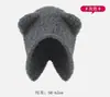 Otoño e invierno nuevo lindo oso sombrero cálido protección facial orejas pequeñas sombrero de lana sombrero de invierno japonés y coreano sombrero de punto versátil
