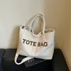 Bolso de mujer de color liso, gran capacidad, pana, nuevo diseño 2026, estampado de letras elegante, bolso de mano, bolso de hombro