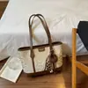Bolso de mano con estampado de leopardo para mujer, nuevo y moderno 2026, bolso tote casual retro de nicho de otoño, bolso de hombro de gran capacidad para el trabajo