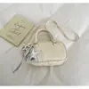 Bolso de Mano Boston de Gama Alta 2026 Nuevo para Primavera/Verano Bolso Cruzado Casual Versátil Bolso de Bowling Dorado