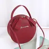 Bolsa Nueva de Primavera para Mujer Bolsa Redonda Pequeña Linda Bolso de Hombro Cruzado Bolso Portátil para Cosméticos Venta al por Mayor de Comercio Exterior Bolsa Pequeña