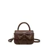 Bolsa de Mão com Laço para Mulheres 2026 Novo Estilo Coreano Moda Nicho Bolsa de Ombro Simples Versátil Bolsa Transversal
