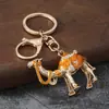 Regalos de Xinjiang al por mayor: Llaveros creativos de camello, llaveros para coche, colgantes decorativos, exquisitos accesorios para bolso con temática de animales para mujer