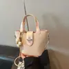 Bolso de mano tipo cubo para mujer, nuevo bolso de hombro de moda de nicho primavera-verano 2026 para el trabajo y los desplazamientos, bolso cruzado