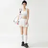 Conjunto de saia-short esportiva de tênis com blocos de cor e borda, com bojos fixos, top regata nadador, saia curta anti-exposição, conjunto de duas peças para fitness e yoga