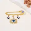 Broche de Borla Olho de Diabo Cravejado de Diamantes Criativo Europeu e Americano, Broche de Estilo Frio para Suéter de Cintura com Olhos Azuis de Alta Qualidade