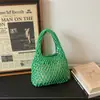 2026 Nova Bolsa de Mão Clutch de Malha Vazada Estilo Coreano Bolsa de Pulso Trançada Bolsa de Mão Fashion para Férias na Praia