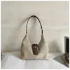 Bolso de mano sencillo y casual para mujer 2026 nuevo bolso de hombro retro coreano bolso cruzado de nicho para el trabajo