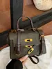 Bolsa de mão de design minimalista de nicho transfronteiriça, bolsa quadrada pequena da moda feminina, bolsa tira-colo para o dia a dia Kelly