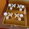 Aretes de clip de perla con mariposa tachonados de circonia para mujeres sin perforaciones, aretes exquisitos y versátiles con un toque de lujo ligero y alta gama, venta al por mayor