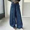 Jeans para Niñas de Primavera y Otoño 2026 Nuevos Casuales Estilo Coreano Niños Medianos y Grandes Pantalones de Pierna Ancha Curvos con Retazos Transfronterizos