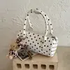 Bolso cilíndrico de moda nuevo 2026 estilo coreano transfronterizo con estampado de lunares único y moderno, versátil para llevar en la mano, al hombro y cruzado