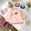 Camiseta de manga larga con estampado de dibujos animados para niños, con cuello semi-alto, adecuada para usar en capas en otoño, ropa infantil al por mayor